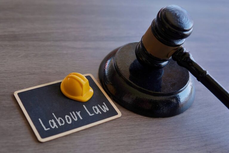 closeup-image-of-yellow-hard-hat-and-judge-gavel-2024-03-19-19-06-57-utc